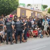 MIgrantes y policía